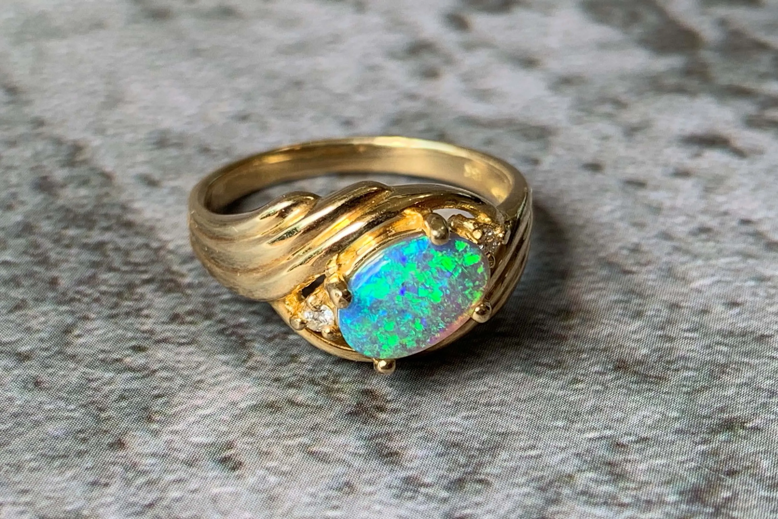 18kt Yellow Gold Black Opal and Diamond slanted ring