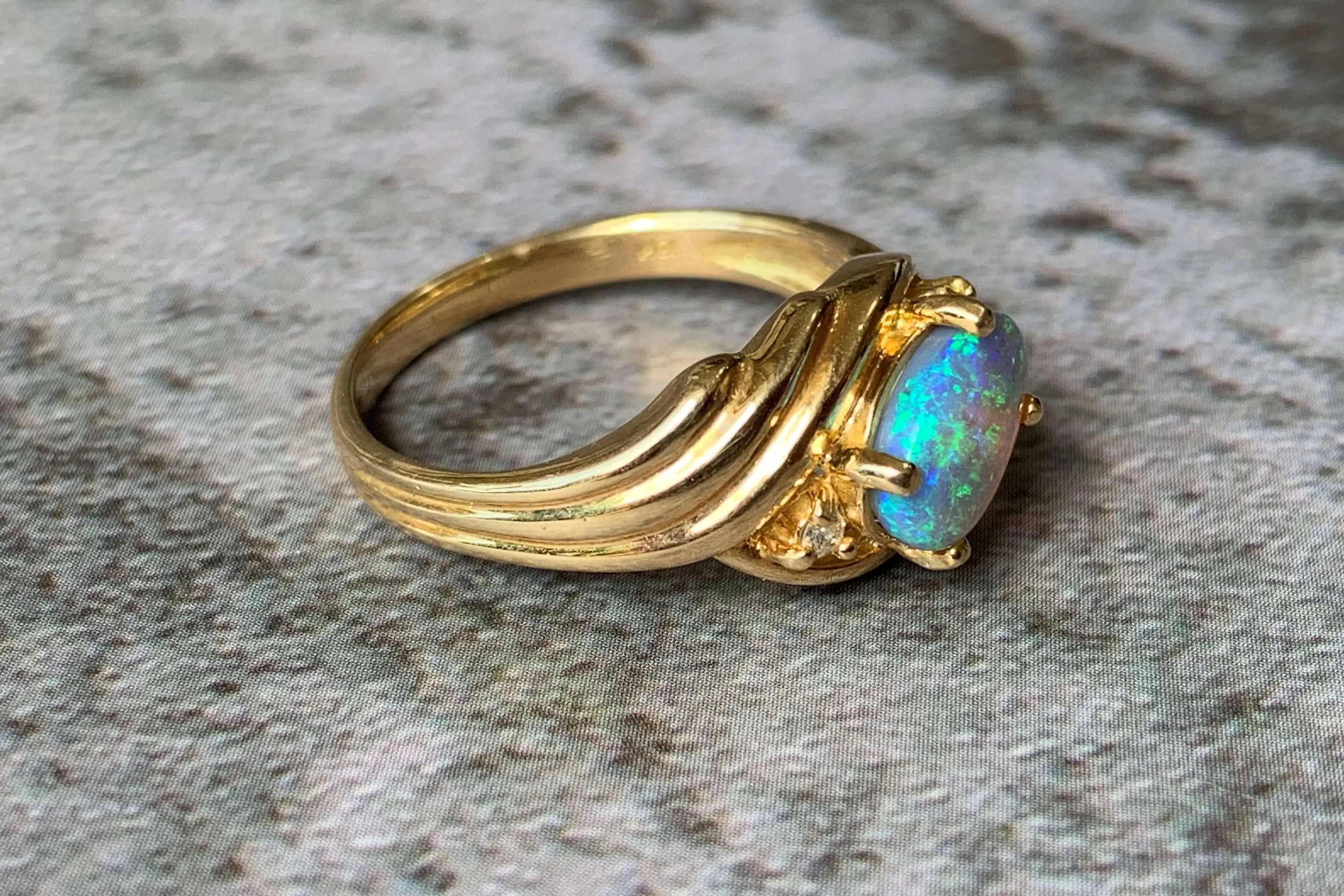 18kt Yellow Gold Black Opal and Diamond slanted ring
