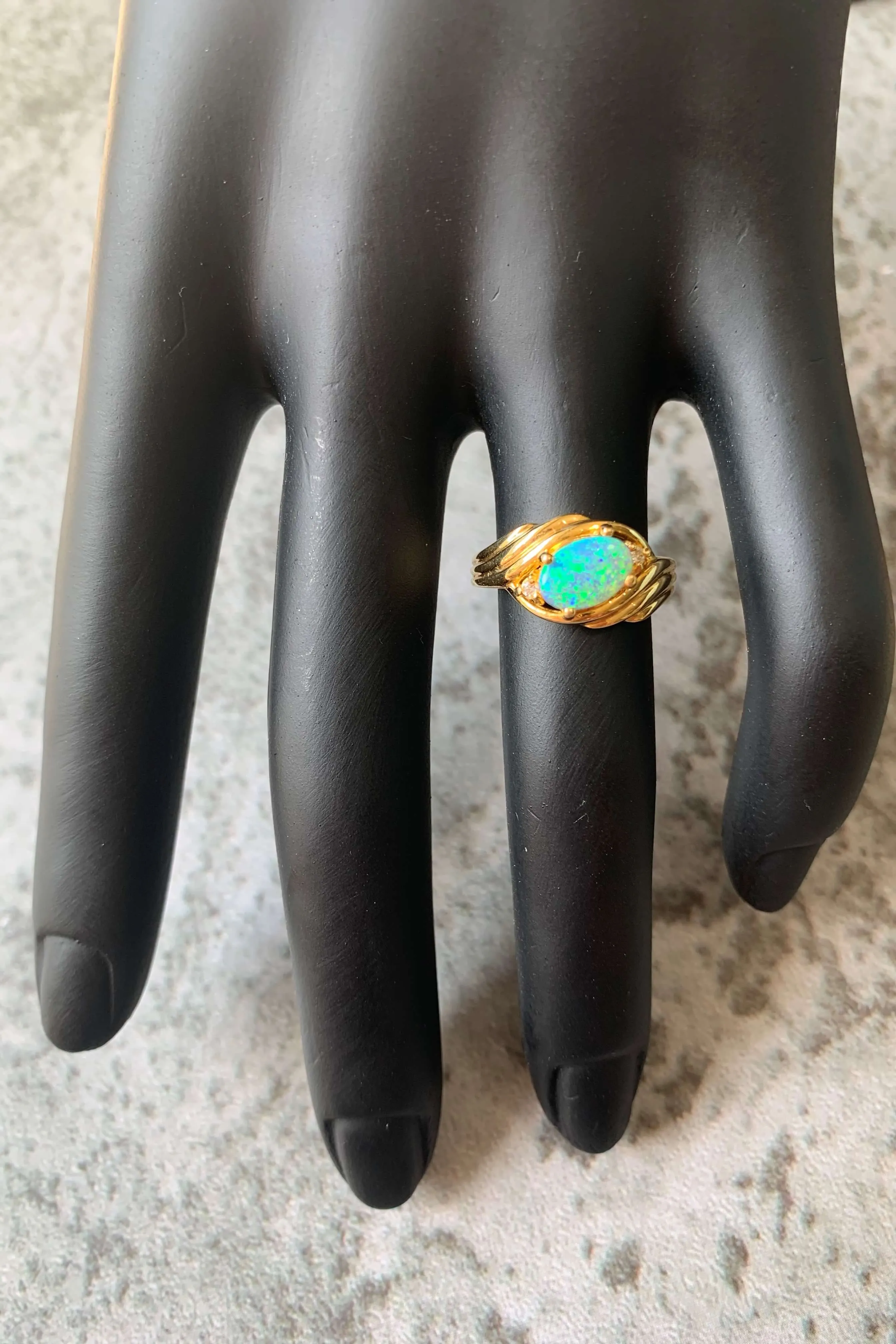 18kt Yellow Gold Black Opal and Diamond slanted ring