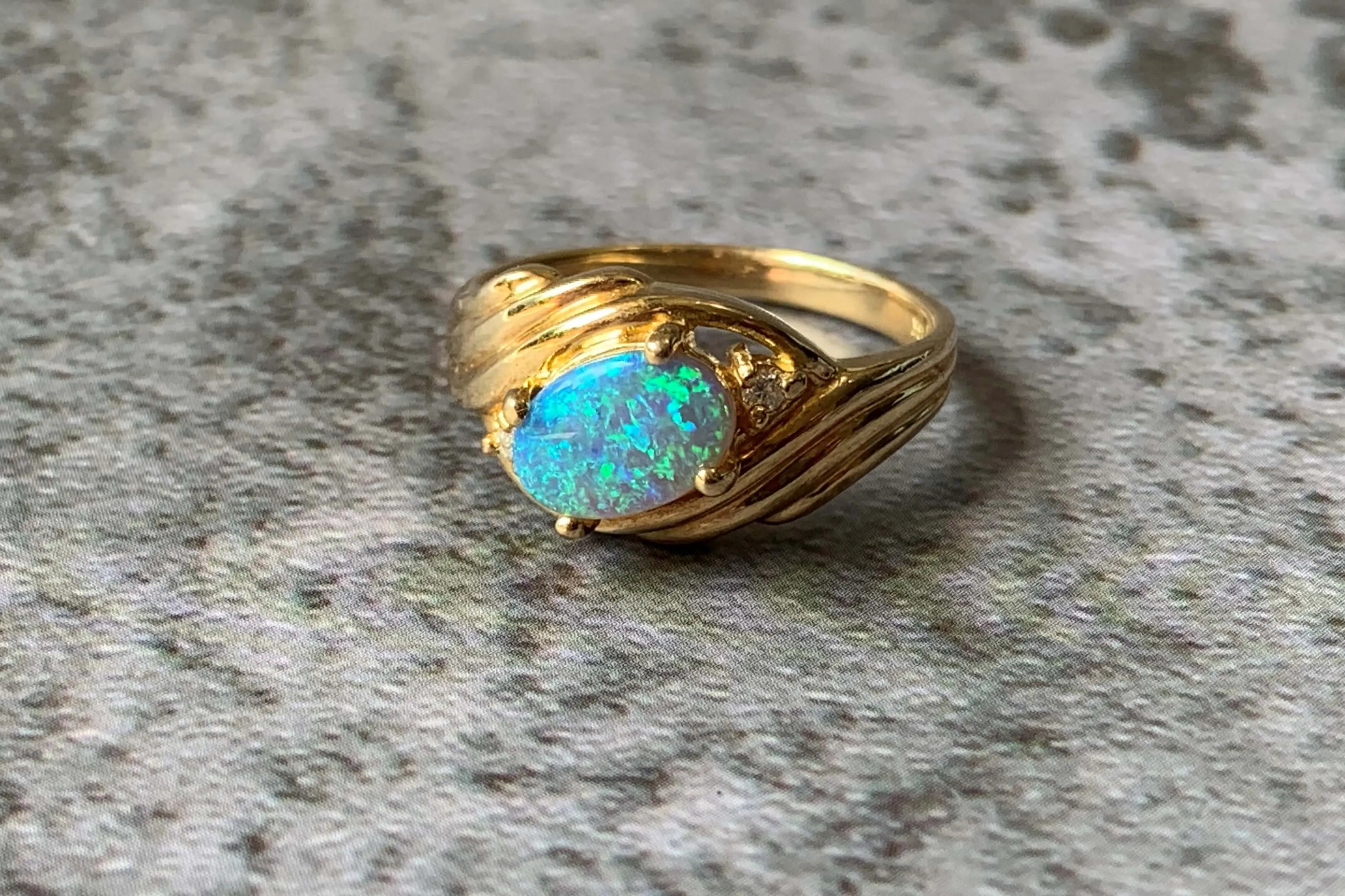 18kt Yellow Gold Black Opal and Diamond slanted ring