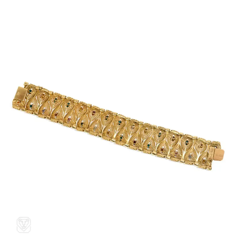Gold stylized leaf and gemset bracelet