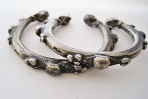 Matching Pair of Small Nubian Silver Currency Bracelets