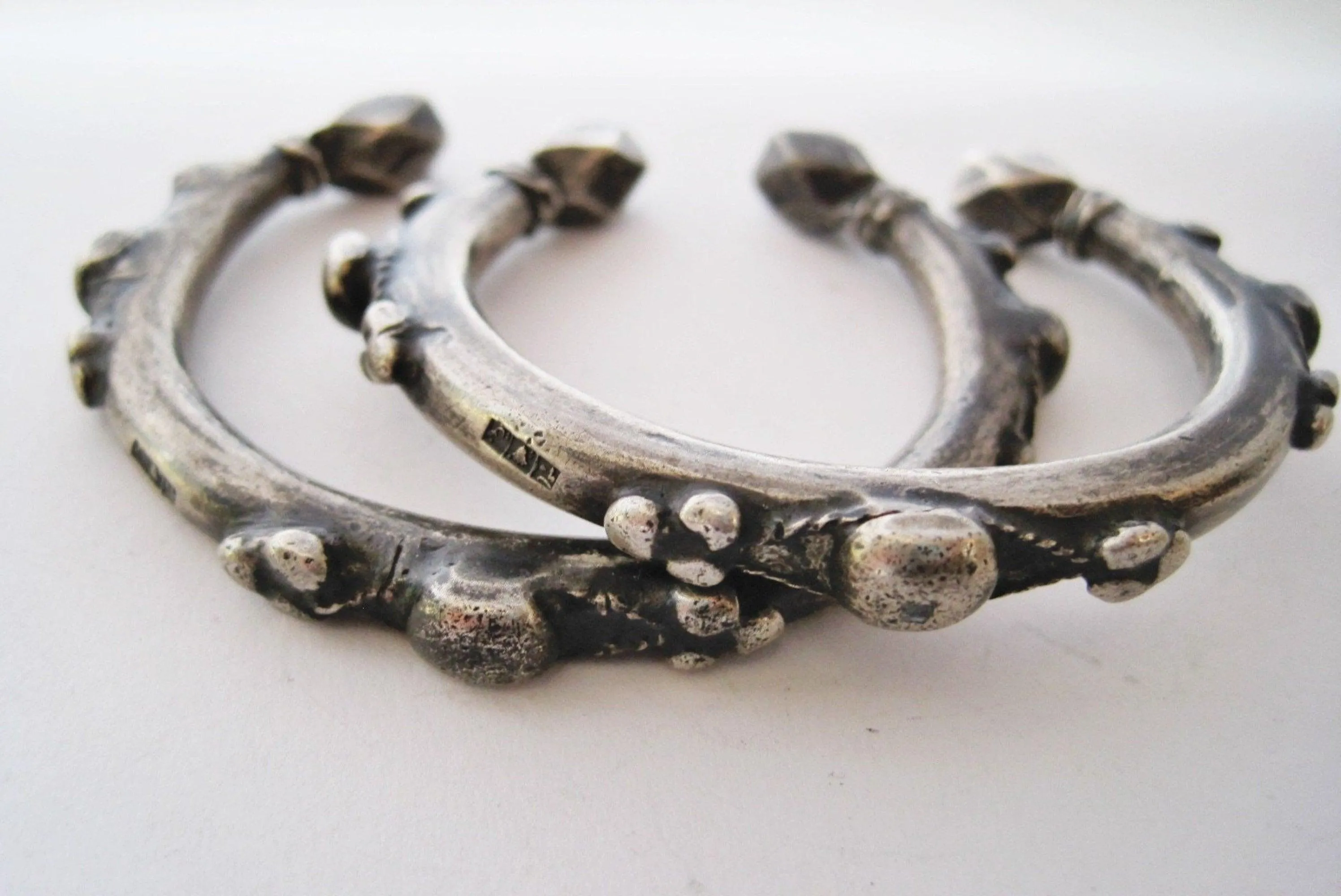 Matching Pair of Small Nubian Silver Currency Bracelets